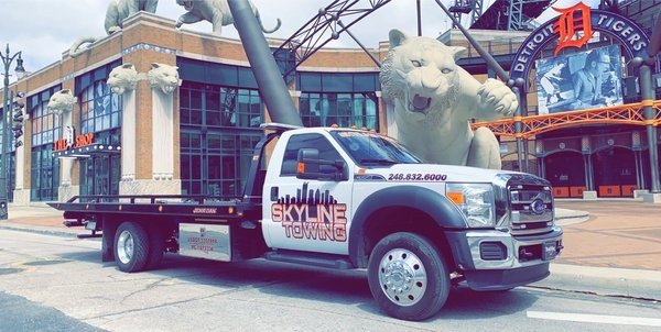 Skyline Towing flatbed parked outside Comerica Park in downtown Detroit